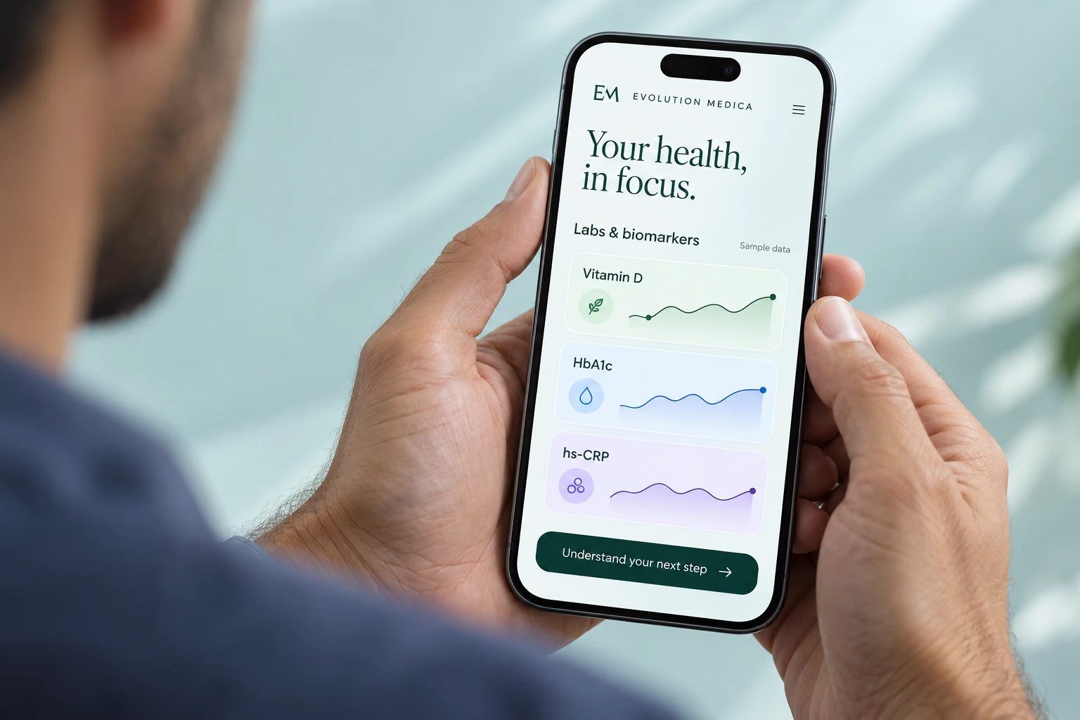 A man viewing an illustrative Evolution Medica lab and biomarker dashboard on a phone